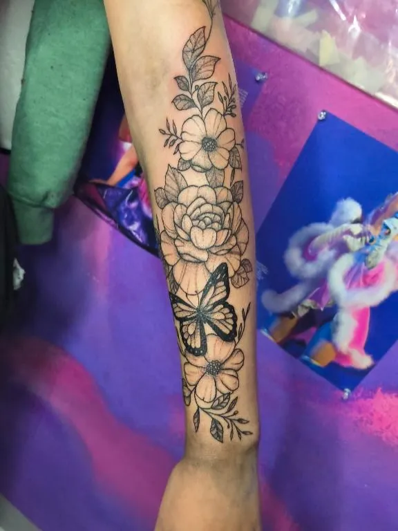 Floral tattoo by Hailey Brooks at Dreamers Ink Studio in Westville, IL