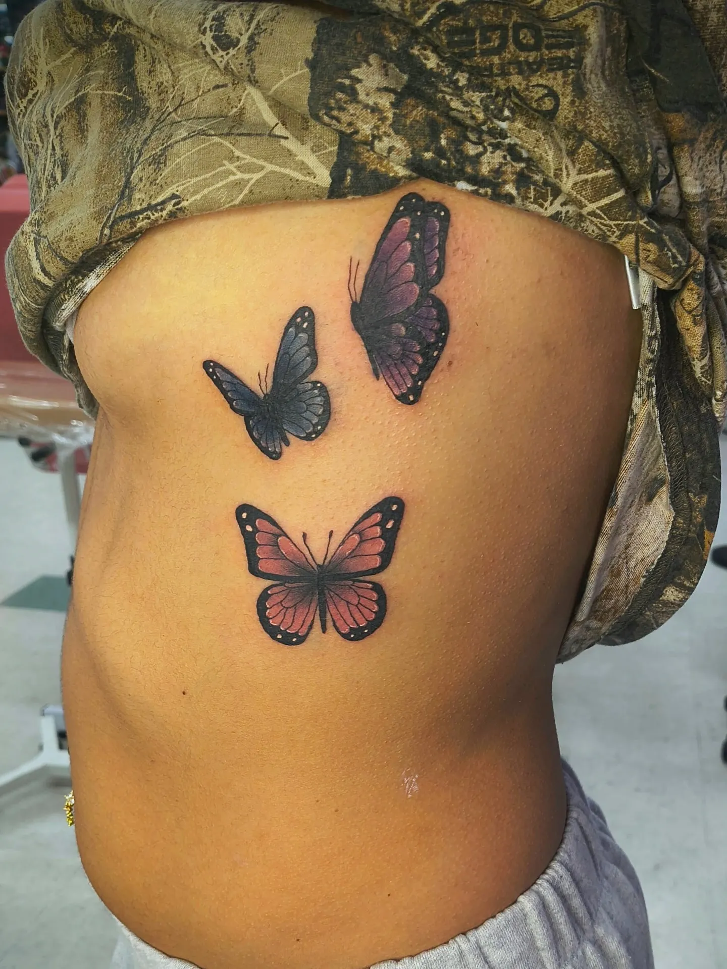Floral tattoo by Hailey Brooks at Dreamers Ink Studio in Westville, IL