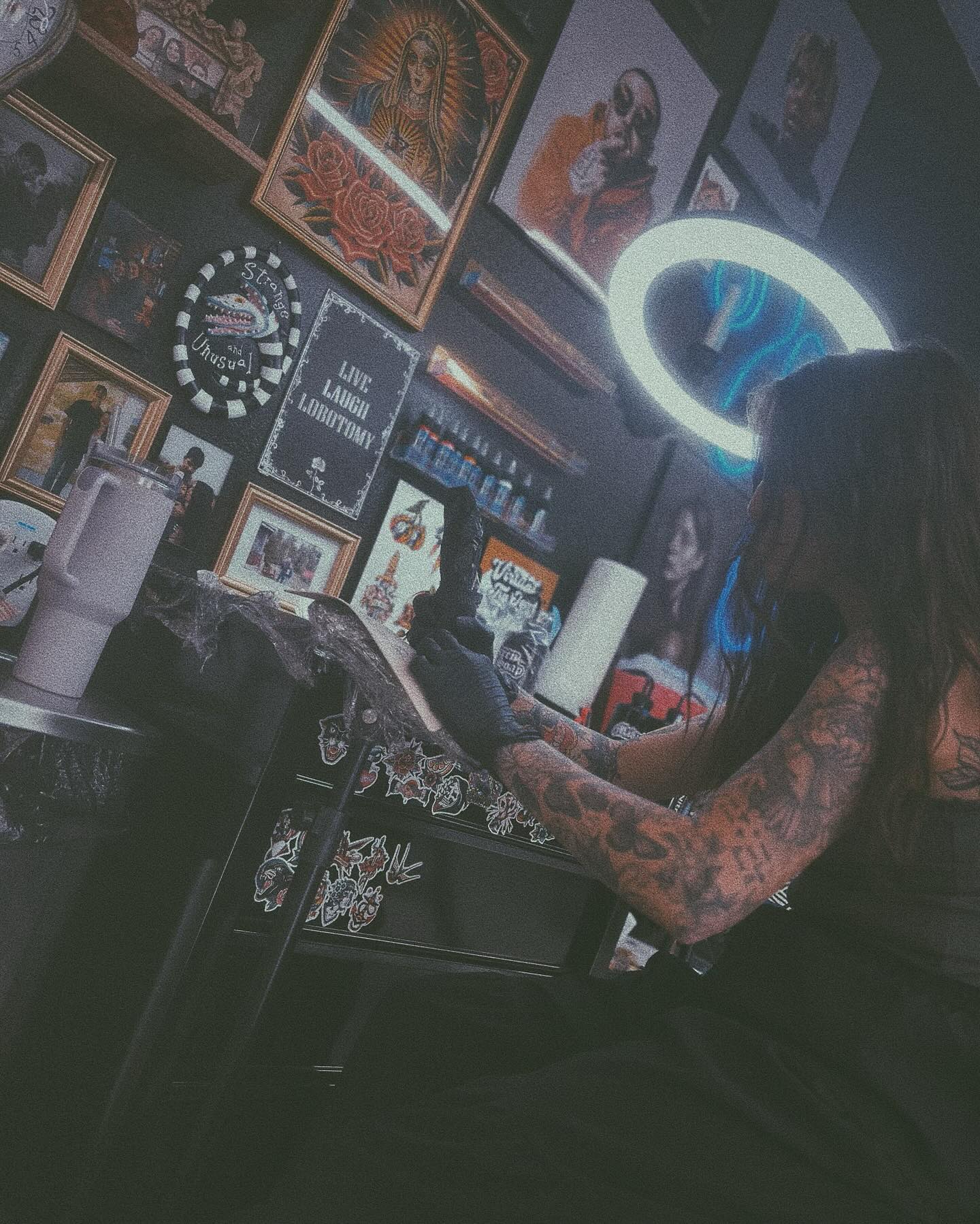 Tattoo artist at work in Dreamers Ink studio